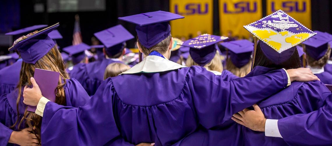 students singing alma mater at commencement